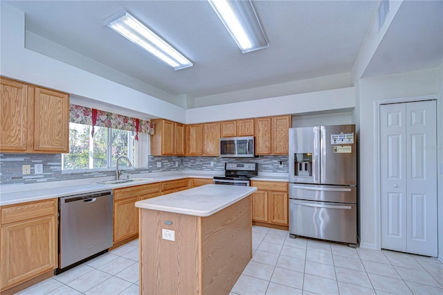 18126 Kara Ct, Tampa, FL 33647 - kitchen featuring appliances with stainless steel finishes, a sink, light tile patterned floors, light countertops, and decorative backsplash