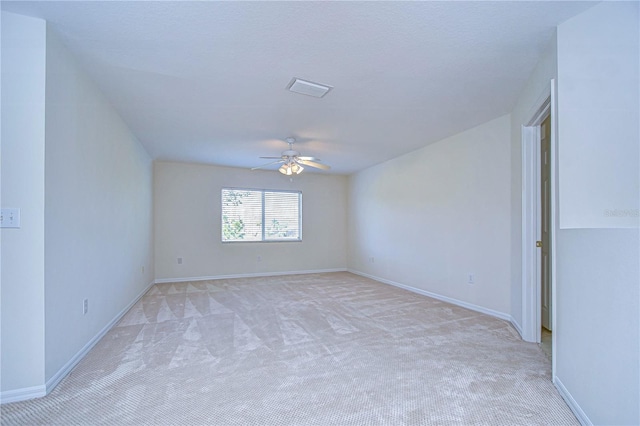 18126 Kara Ct, Tampa, FL 33647 - spare room featuring light carpet, ceiling fan, and baseboards