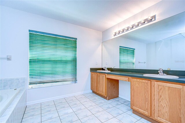 18126 Kara Ct, Tampa, FL 33647 - bathroom with double vanity, tile patterned flooring, and tiled bath