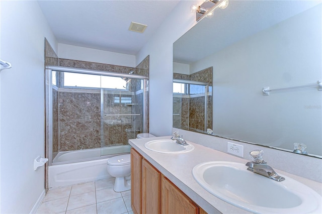 18126 Kara Ct, Tampa, FL 33647 - bathroom with toilet, enclosed tub / shower combo, tile patterned floors, and double vanity