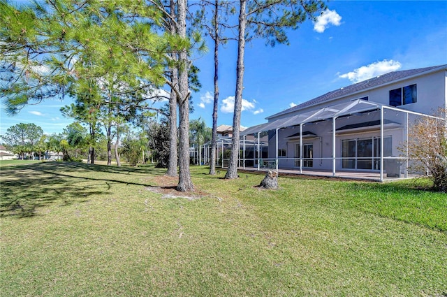 18126 Kara Ct, Tampa, FL 33647 - view of grassy yard with a lanai