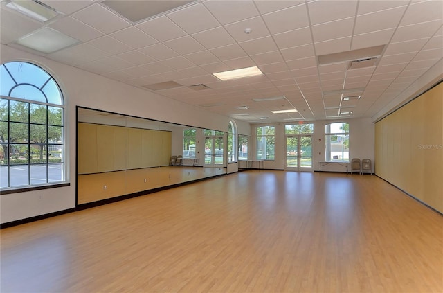 18126 Kara Ct, Tampa, FL 33647 - empty room featuring wood finished floors and a drop ceiling