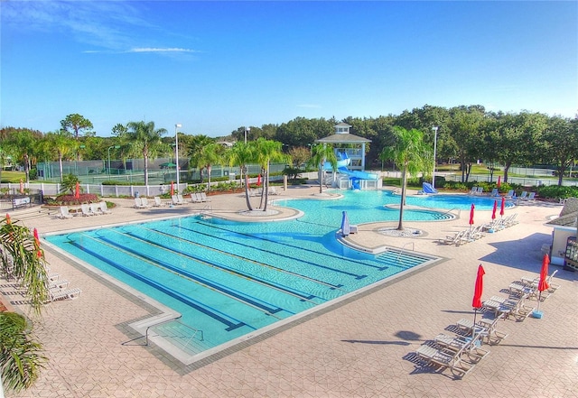 18126 Kara Ct, Tampa, FL 33647 - community pool featuring a water slide and a patio area