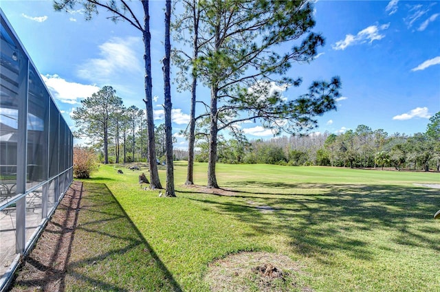 18126 Kara Ct, Tampa, FL 33647 - view of green lawn with view of scattered trees, a lanai, and golf course view