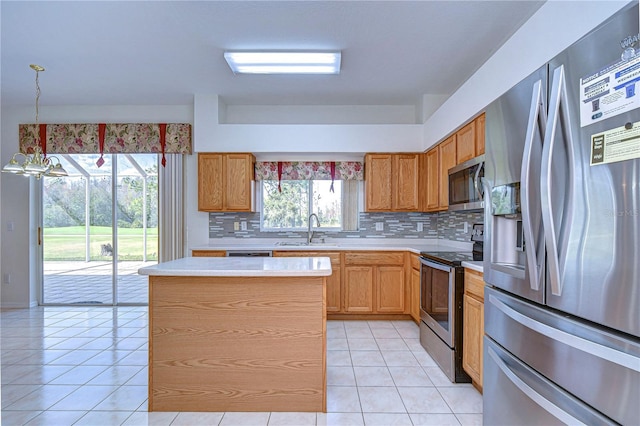 18126 Kara Ct, Tampa, FL 33647 - kitchen featuring stainless steel appliances, a sink, light countertops, and decorative backsplash