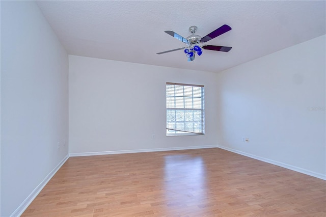 18126 Kara Ct, Tampa, FL 33647 - spare room featuring light wood-style floors, ceiling fan, and baseboards