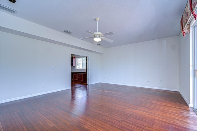 18126 Kara Ct, Tampa, FL 33647 - empty room featuring ceiling fan, dark wood-type flooring, and baseboards