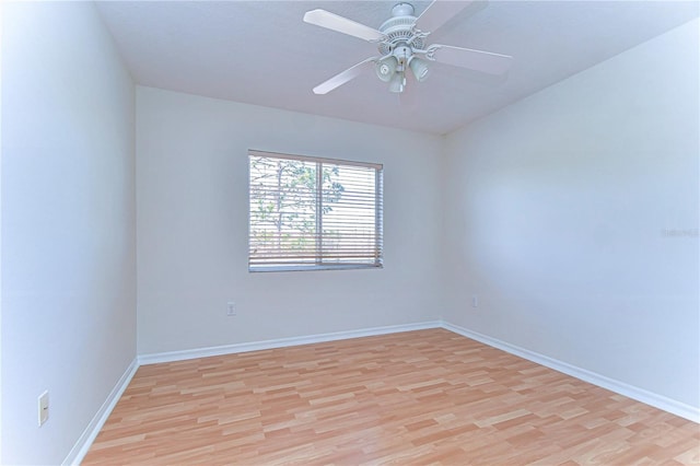 18126 Kara Ct, Tampa, FL 33647 - spare room with light wood-style flooring, baseboards, and a ceiling fan