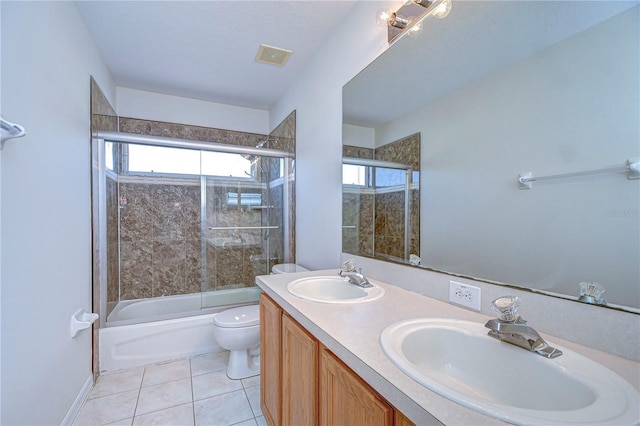 18126 Kara Ct, Tampa, FL 33647 - bathroom with toilet, enclosed tub / shower combo, tile patterned flooring, and double vanity