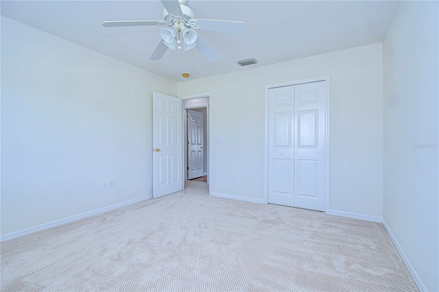 18126 Kara Ct, Tampa, FL 33647 - unfurnished bedroom with carpet floors, a closet, baseboards, and ceiling fan