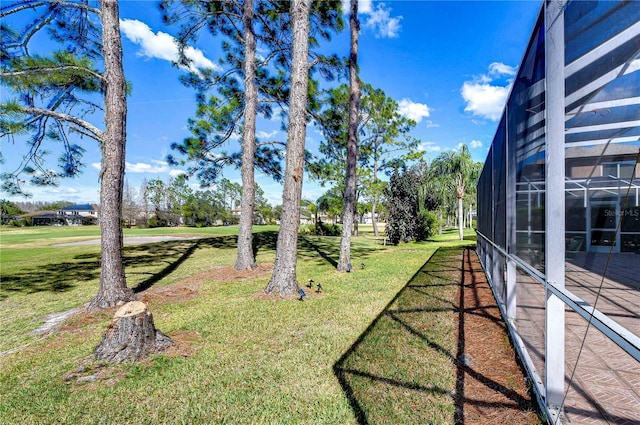 18126 Kara Ct, Tampa, FL 33647 - view of grassy yard featuring a lanai