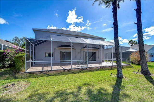 18126 Kara Ct, Tampa, FL 33647 - rear view of house with a patio area, a yard, a lanai, and stucco siding