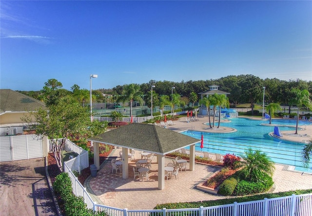 18126 Kara Ct, Tampa, FL 33647 - surrounding community featuring a gazebo, a fenced backyard, a pool, and a patio