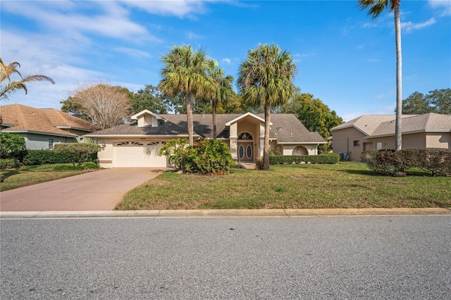 ranch-style house with a garage and a front lawn