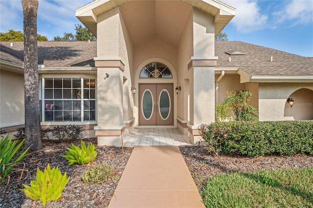 9405 Ashley Dr, Weeki Wachee, FL 34613 - property entrance with a shingled roof and stucco siding