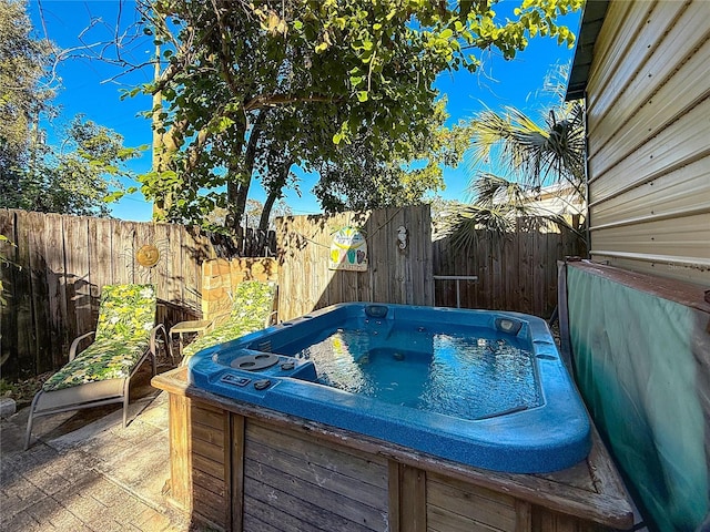 view of pool featuring a hot tub