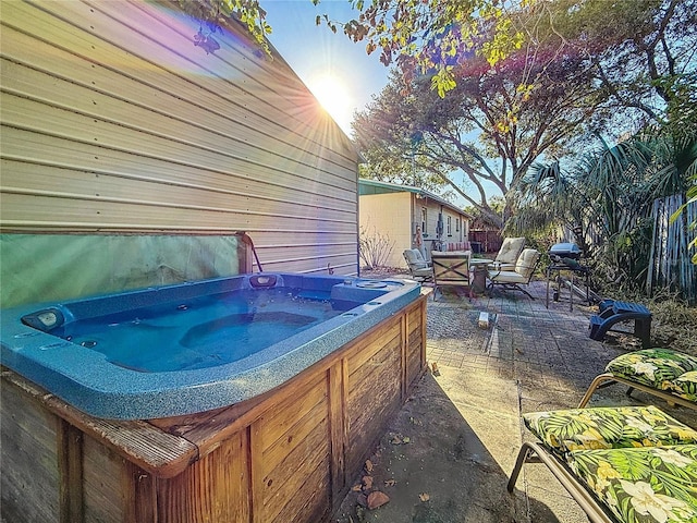 view of patio / terrace with a hot tub