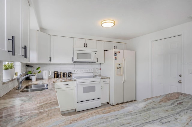 kitchen with white cabinetry, sink, white appliances, and backsplash