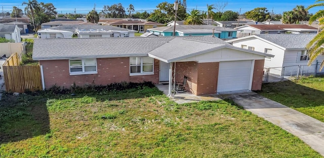 single story home featuring a garage and a front yard