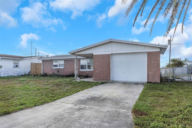 single story home with a garage and a front lawn