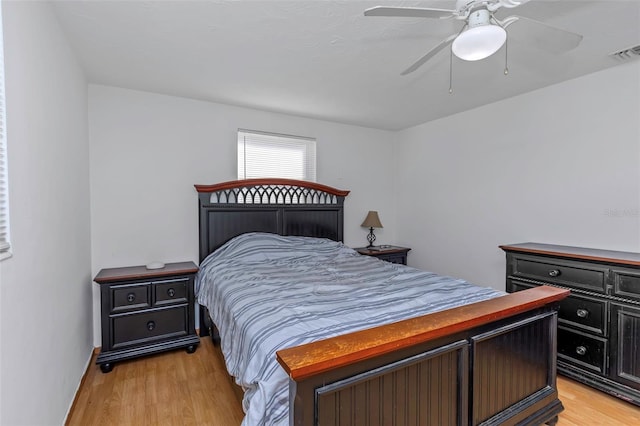 bedroom with ceiling fan and light hardwood / wood-style flooring