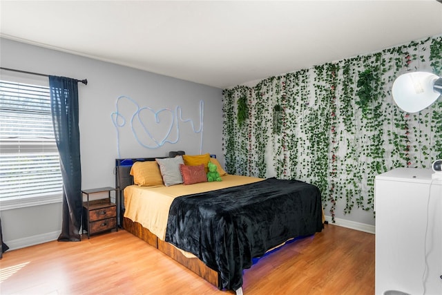 bedroom with wood-type flooring