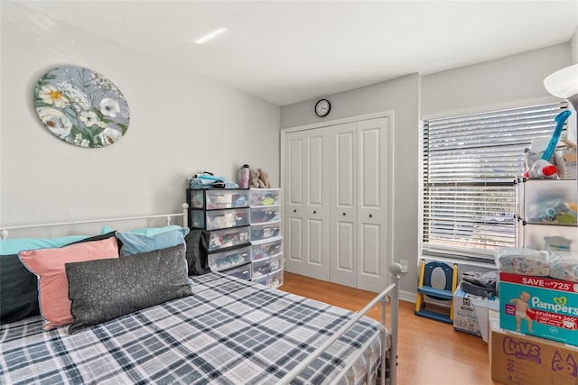 bedroom with a closet and light wood-type flooring