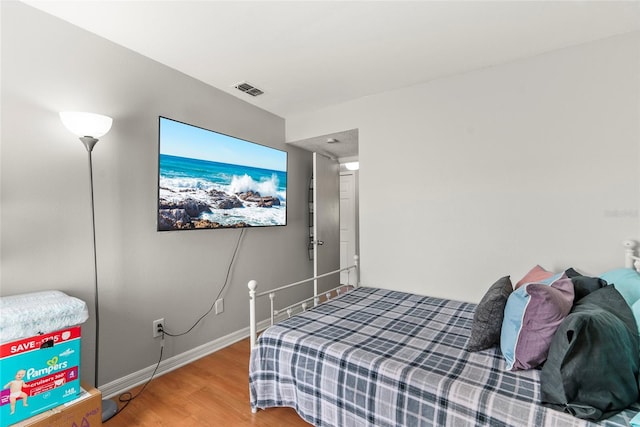 bedroom featuring hardwood / wood-style flooring