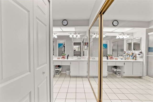 bathroom with tile patterned floors and vanity