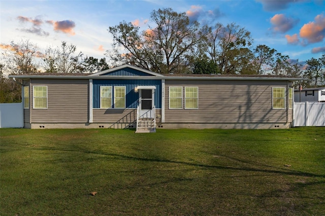 view of front of property with a lawn