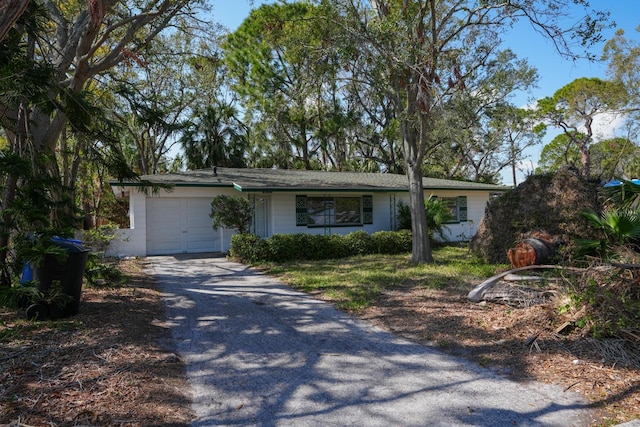 single story home featuring a garage