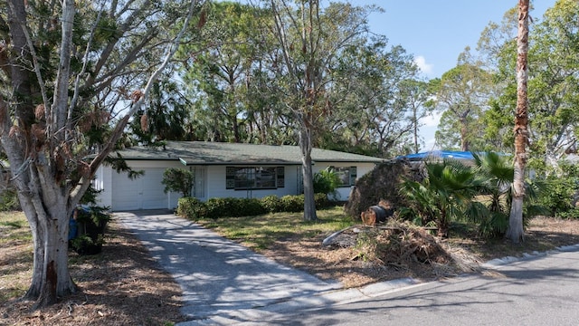 ranch-style house featuring a garage