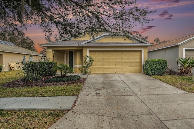 view of front of property with a garage