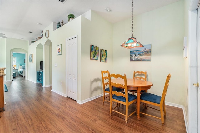 dining area with wood-type flooring