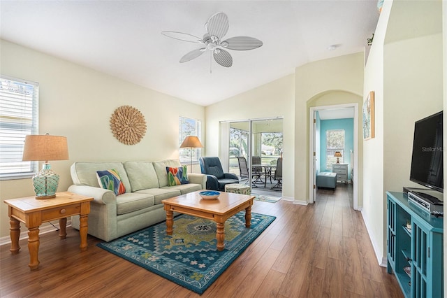 living room featuring ceiling fan, lofted ceiling, and dark hardwood / wood-style flooring