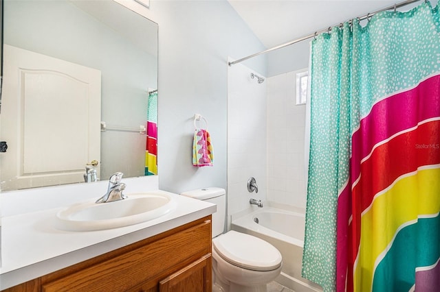 full bathroom featuring shower / bath combo, vanity, and toilet