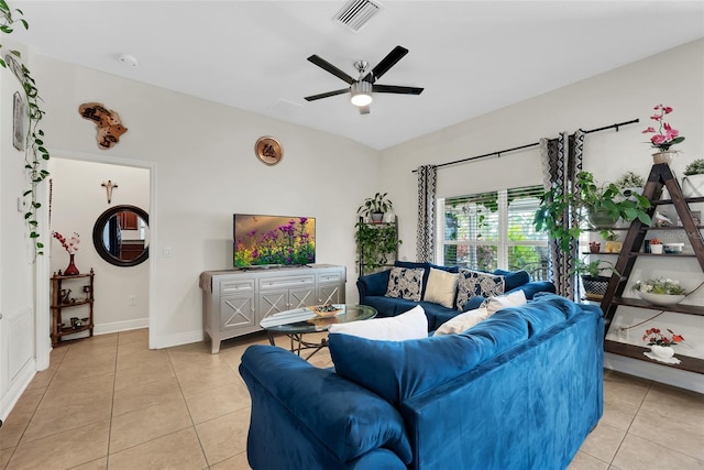 living area with baseboards, visible vents, a ceiling fan, and light tile patterned flooring