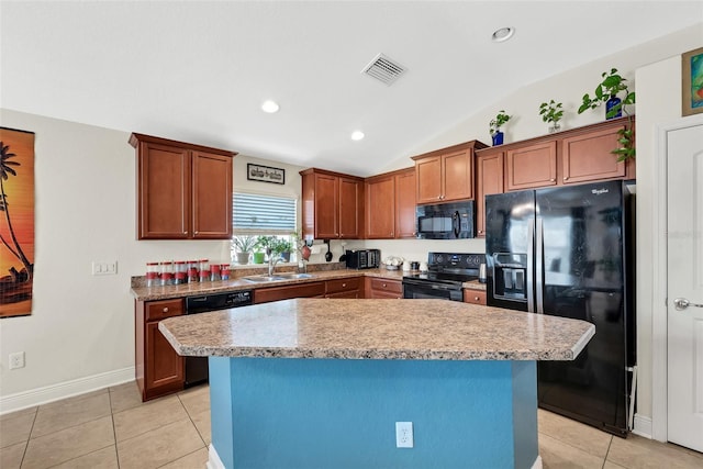 kitchen featuring a center island, visible vents, a sink, and black appliances