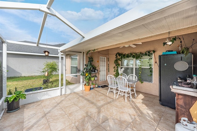 sunroom featuring beam ceiling and a wealth of natural light