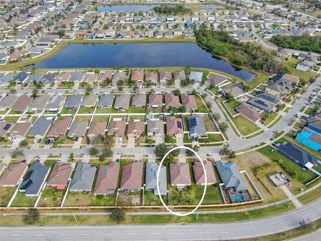 aerial view with a water view and a residential view