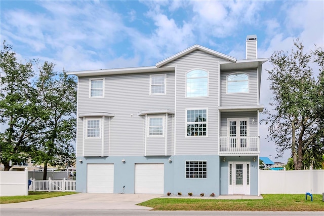 view of front of property with a garage