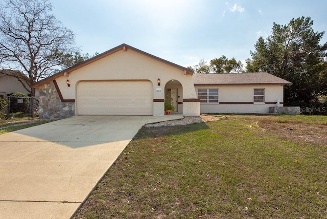 view of front facade with a garage and a front yard