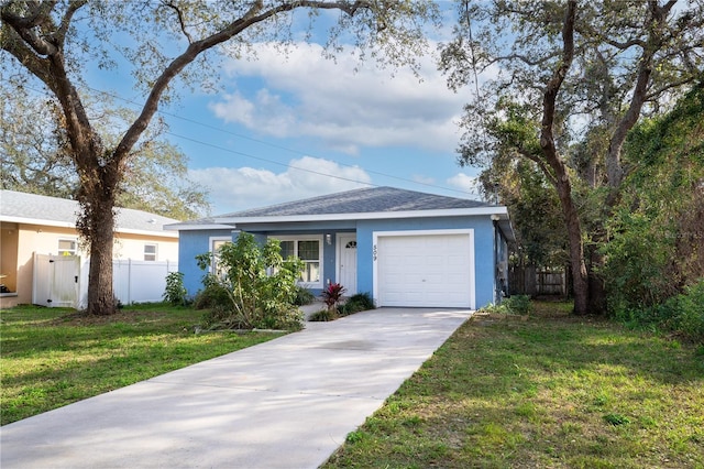 ranch-style home with a garage, a front yard, fence, and driveway