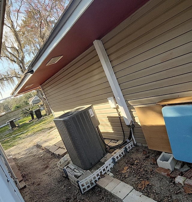 exterior details with a patio area and central AC