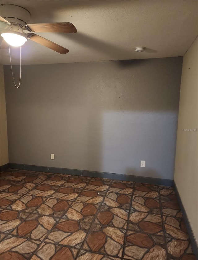 6328 W Park Dr, Homosassa, FL 34446 - spare room featuring baseboards and a ceiling fan