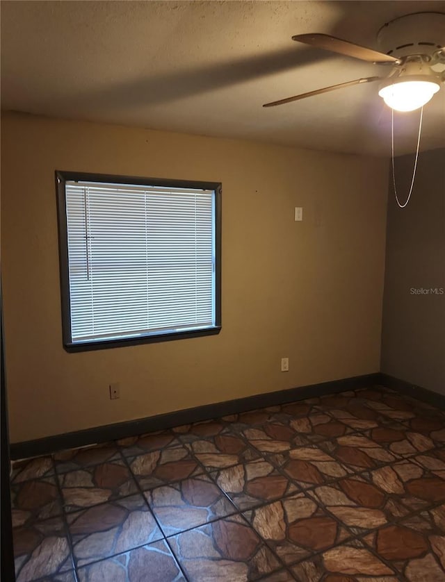 6328 W Park Dr, Homosassa, FL 34446 - spare room featuring baseboards and ceiling fan