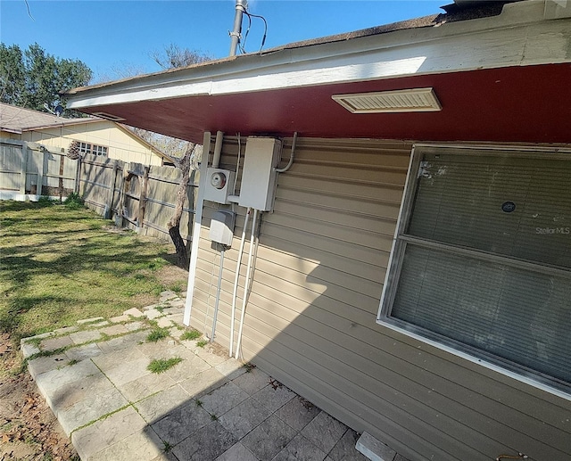 6328 W Park Dr, Homosassa, FL 34446 - exterior details with electric meter and fence