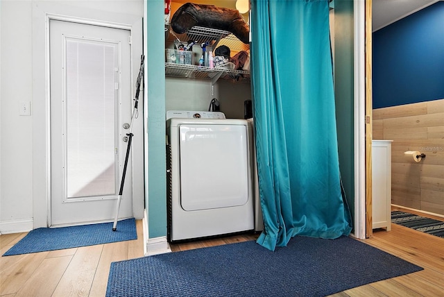 laundry area featuring washer / dryer and light hardwood / wood-style floors