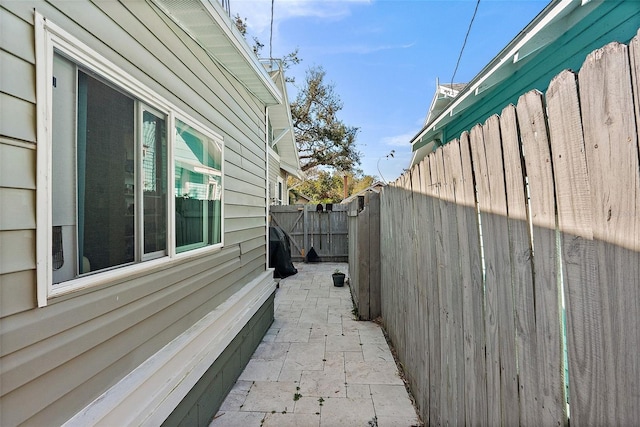 view of side of home featuring a patio