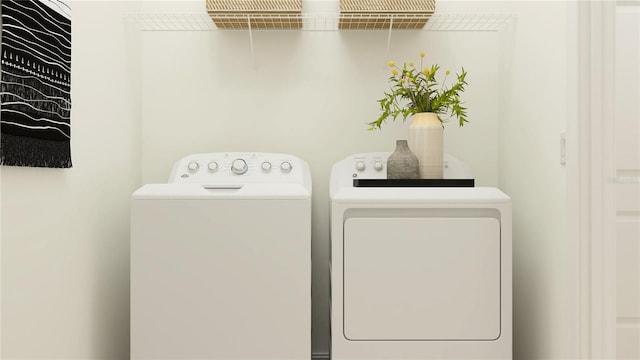 laundry area with independent washer and dryer